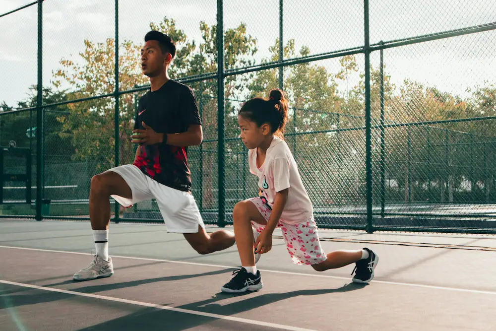 Private tennis coach on a home court in London