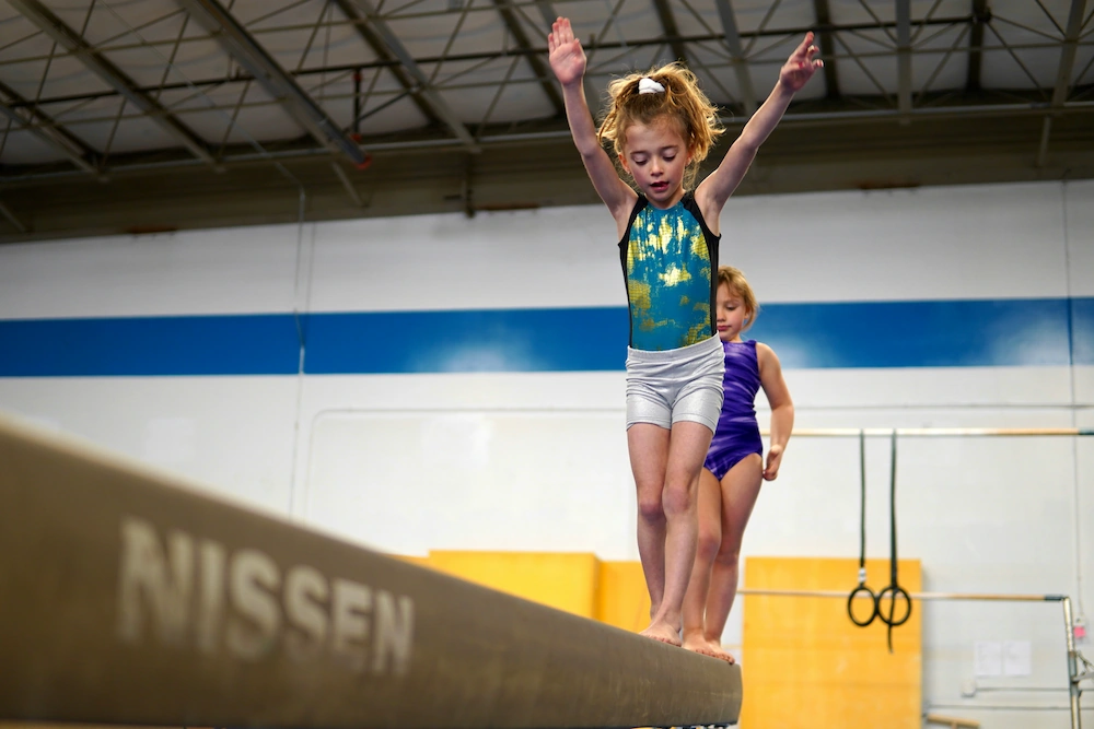Child practising gymnastics tailored to age and level